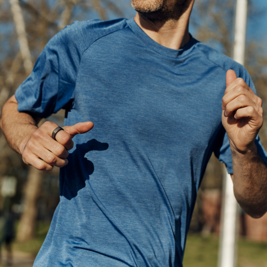 Person running wearing Oura ring 