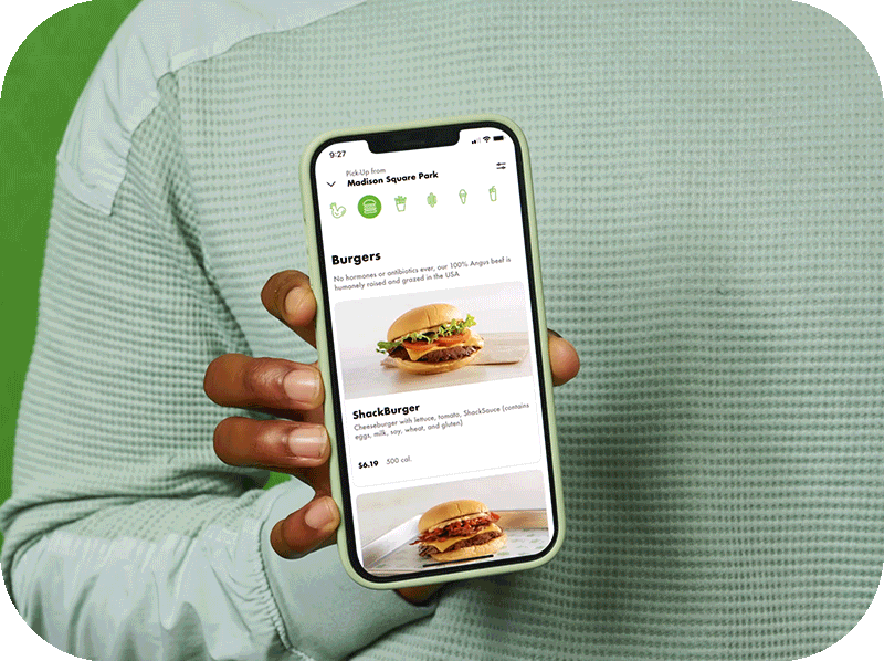 ShackBurger comes towards camera and turns into cell phone as it pulls back