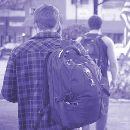 people walking wearing backpacks.png