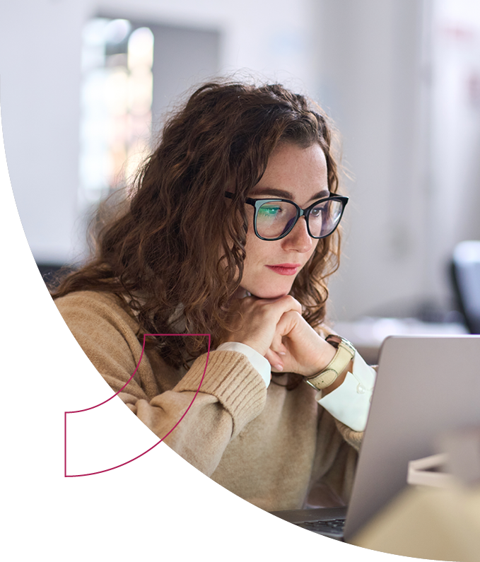 Woman looking intently at computer screen