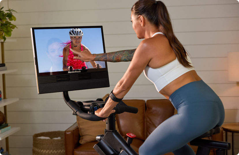 Woman riding NordicTrack X24 exercise bike Woman riding NordicTrack X24 exercise bike