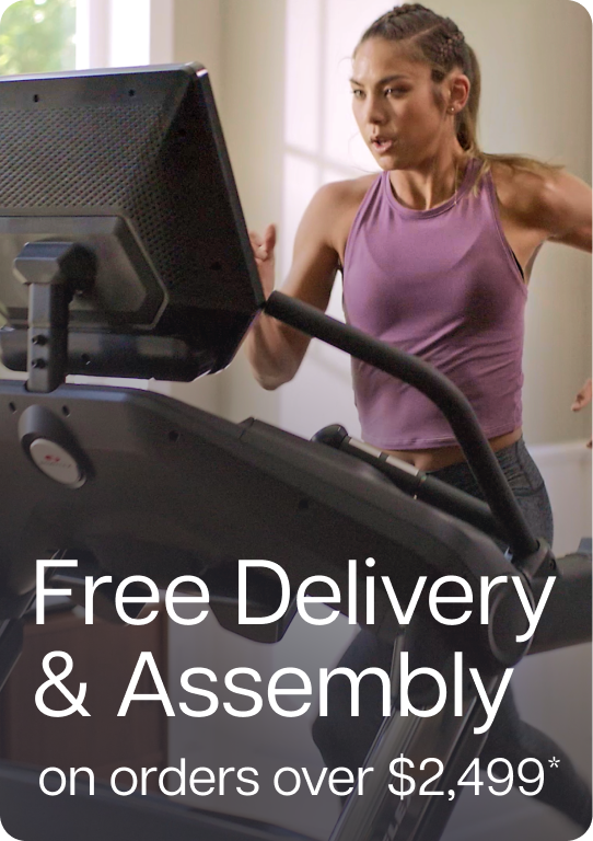 Woman in purple tank top running on BowFlex Treadmill 22 Woman in purple tank top running on BowFlex Treadmill 22