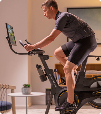 Man riding Matrix IC50 in home office Man riding Matrix IC50 in home office