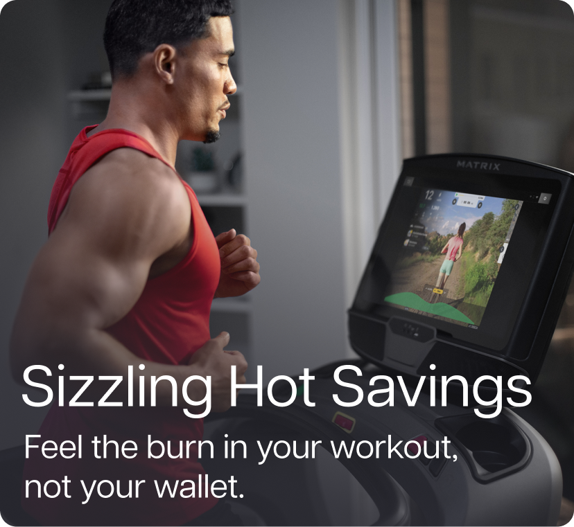 Man running on Matrix treadmill while watching trainer videos on large XUR display