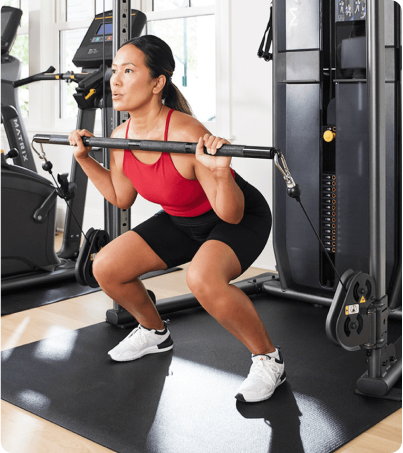 Woman performing barbell squats with Matrix FTR30 Woman performing barbell squats with Matrix FTR30