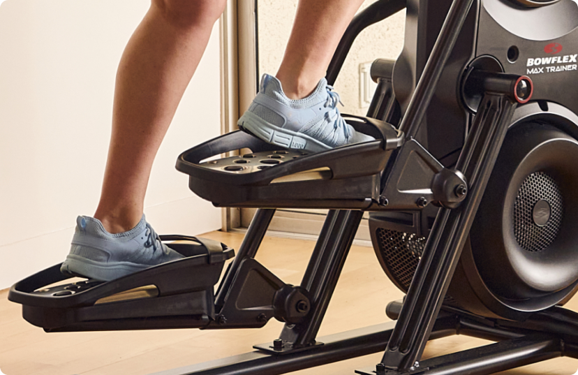 Close up of person working out on Bowflex Max Trainer. Close up of person working out on Bowflex Max Trainer.