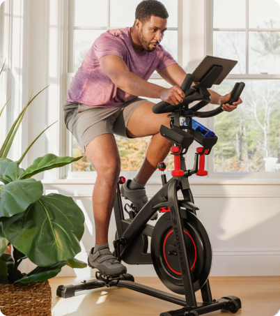 Man working out on BowFlex C6 Bike at home Man working out on BowFlex C6 Bike at home