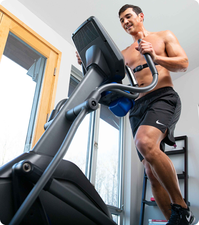Shirtless man using Horizon Eliiptical Shirtless man using Horizon Eliiptical