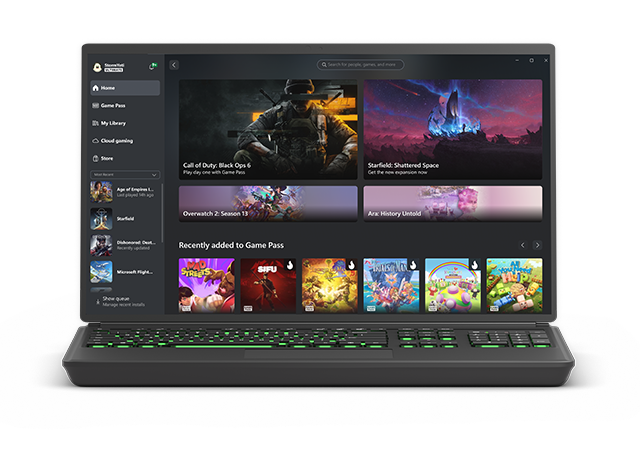 A laptop running the Xbox app with notable Xbox games displayed.