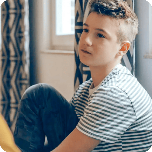 teen boy looking sad and pensive