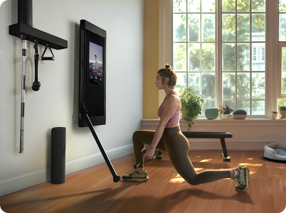 Woman working out with Tonal 2 in modern home