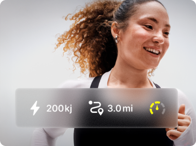 Woman running with a Peloton overlay showing output and distance metrics
