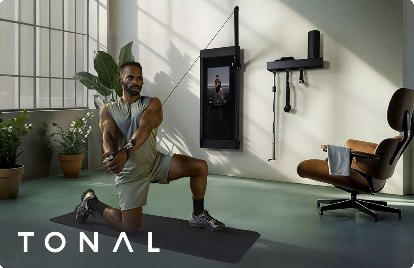 Man using Tonal 2 smart home gym in industrial loft