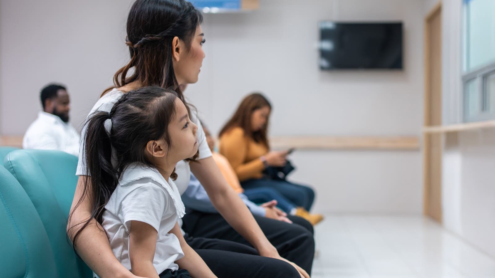 Mother and child in hospital waiting room image