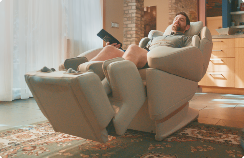 Man relaxing in Synce JP1100 4D Massage Chair in home