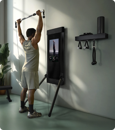 Man lifting with the Tonal 2 Smart Home Gym at home Man lifting with the Tonal 2 Smart Home Gym at home