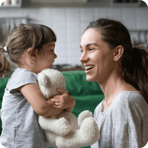 toddler girl playing a 10-minute game with her mom