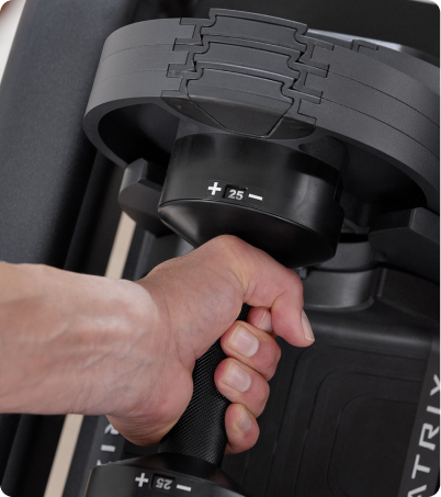 Woman in red leggings riding Matrix upright bike Woman in red leggings riding Matrix upright bike