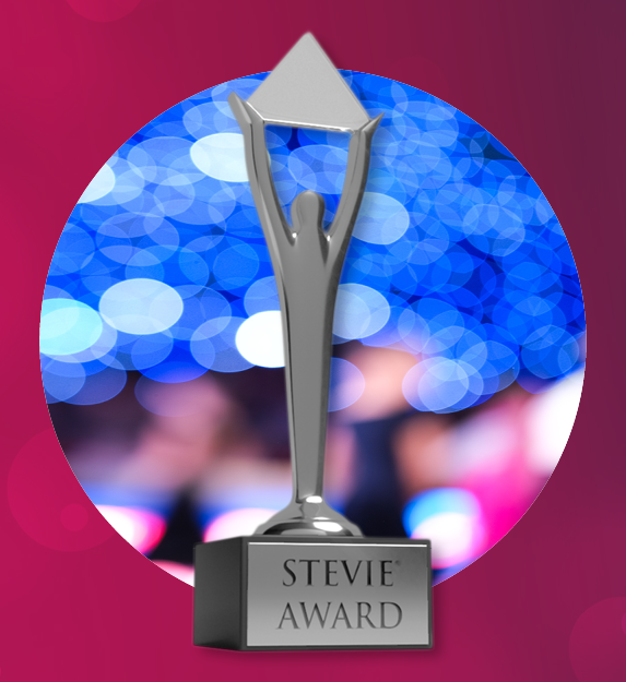 Photo of Susan Armiger holding an award