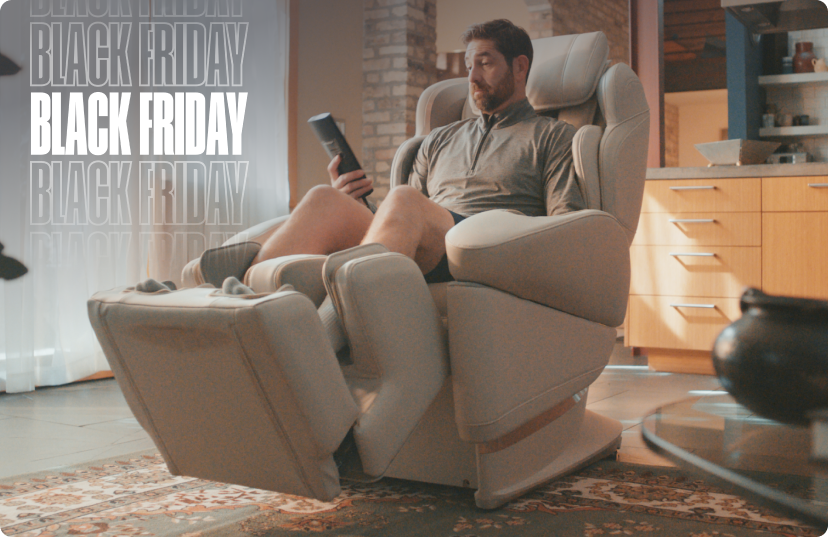 Man relaxing in Synca JP1100 massage chair in home