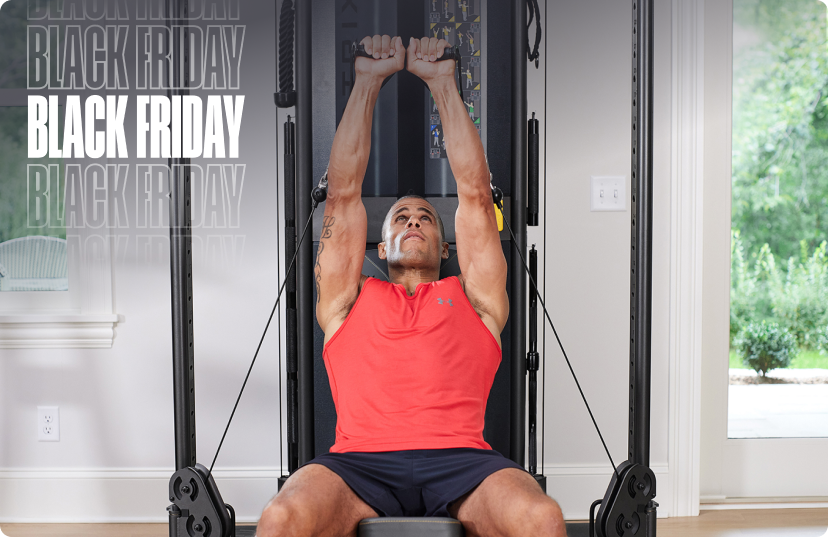 Man in red tanktop working out on Matrix FTR30 functional trainer