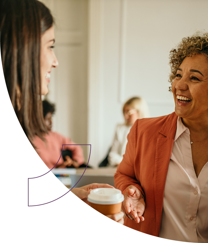 Smiling clinician speaking with woman