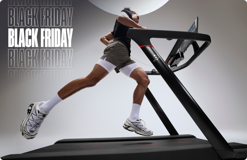 Man running on Peloton Tread in bright studio