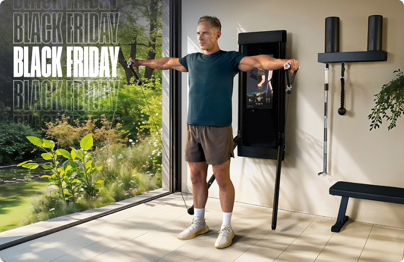 Man running using Tonal 2 Smart Gym in modern living room Man running using Tonal 2 Smart Gym in modern living room