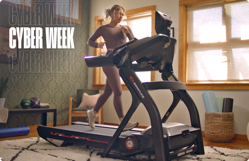 Woman running on BowFlex treadmill at home