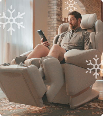 Man relaxing in his Synca JP1100 massage chair at home