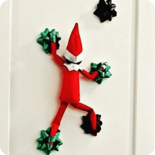 elf on the shelf ideas like the elf rock climbing on bows