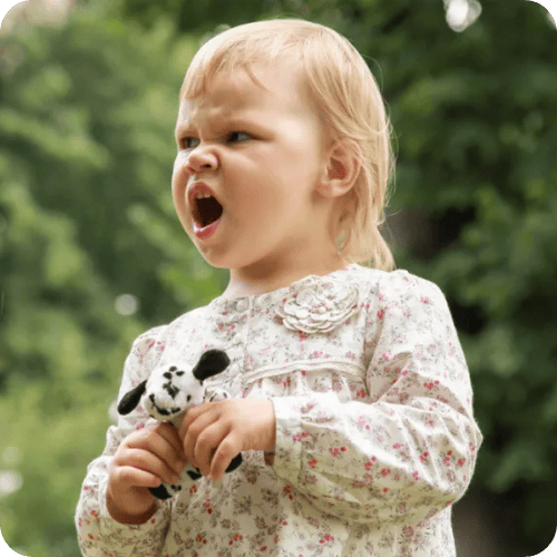 an angry toddler saying no
