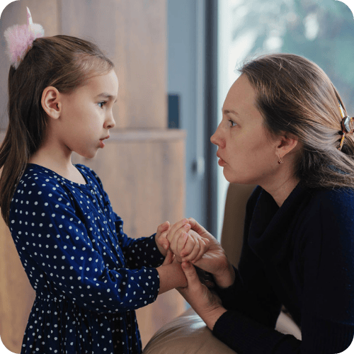 a girl talking to her mom, who used a phrase that secretly undermines kids confidence