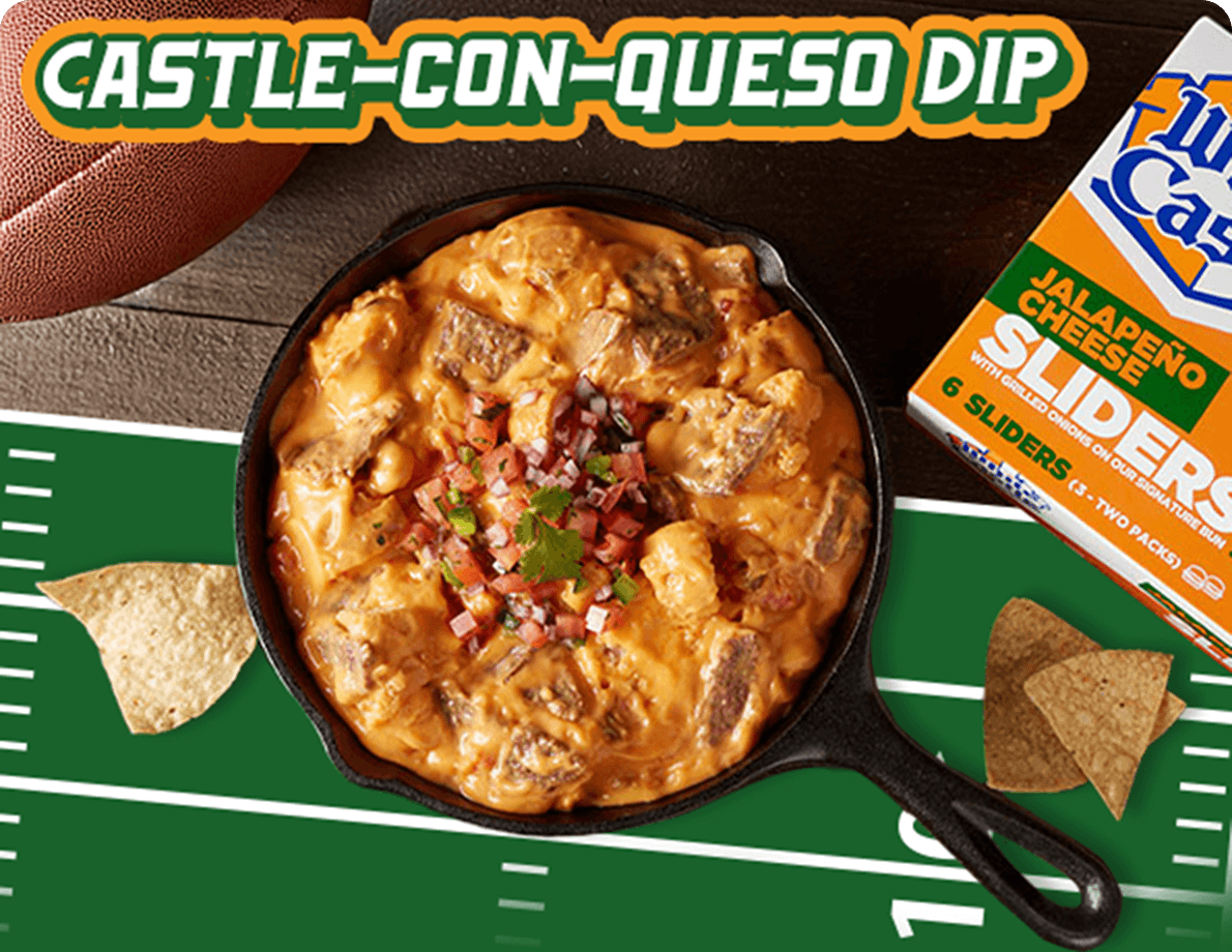 Image of Castle-Con-Queso Dip in a cast iron skillet on a football field-themed placemat with tortilla chips and White Castle® Jalapeño Cheese Sliders packaging. Select the link to view the recipe.