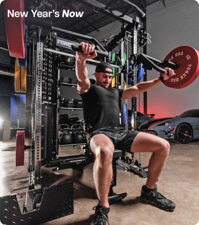 Man working out on Force USA All-In-One Trainer in industrial garage