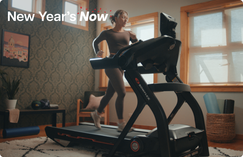 Woman running on BowFlex Treadmill 10 in home