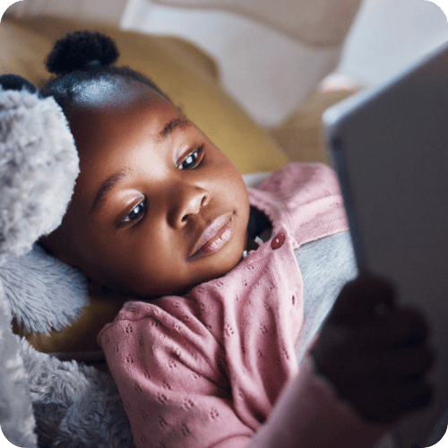 a little girl using an ipad who will surely have a meltdown when time is up