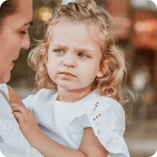little girl giving mom the stink eye