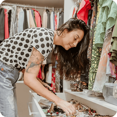 woman in house organizing someone's closet