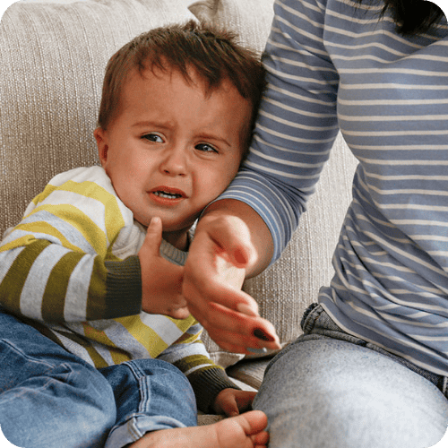 a mom with crying toddler trying to figure out how to handle toddler tantrums