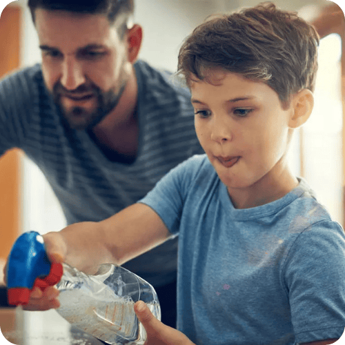 a boy doing his chores and helping to clean