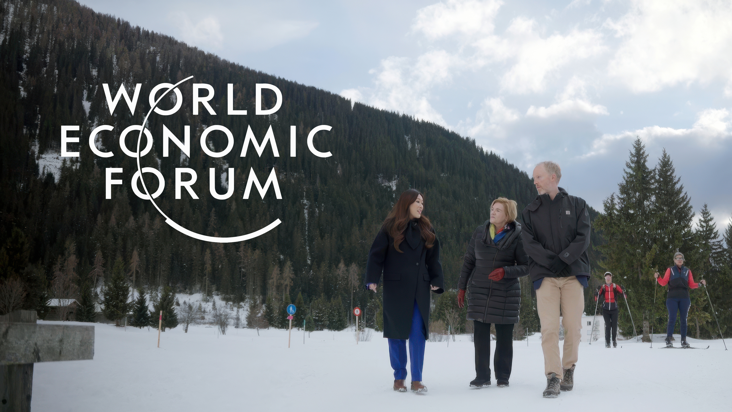 3 people walking in the snow in Davos, Switzerland