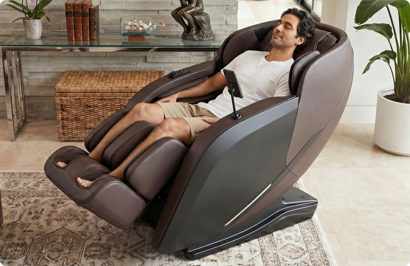 Man relaxing in a luxurious brown Fujiryoki J POD massage chair with in a modern living room.
