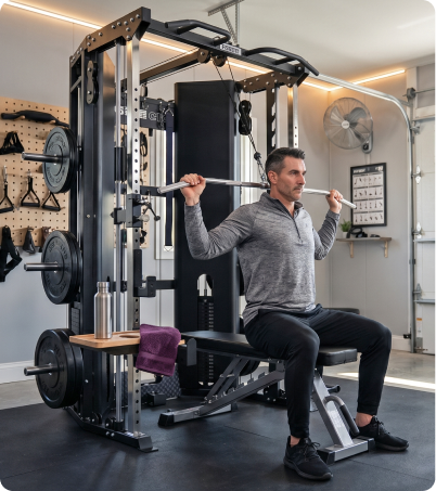 Man in gray workout gear doing pulldowns on Force USA C10 Trainer
