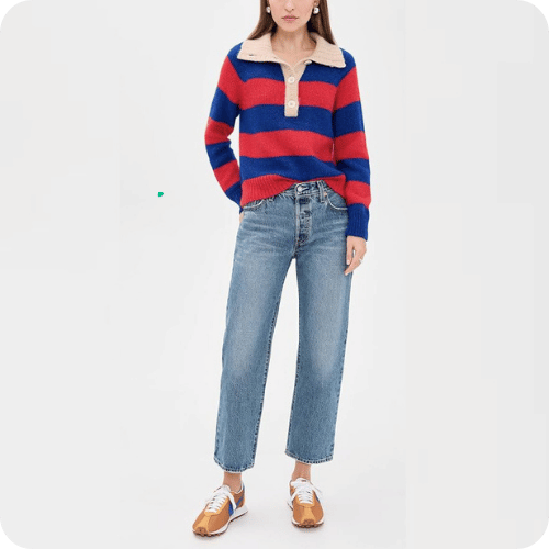 a model wearing levi's 501 '90s ankle jeans with a striped sweater and sneakers