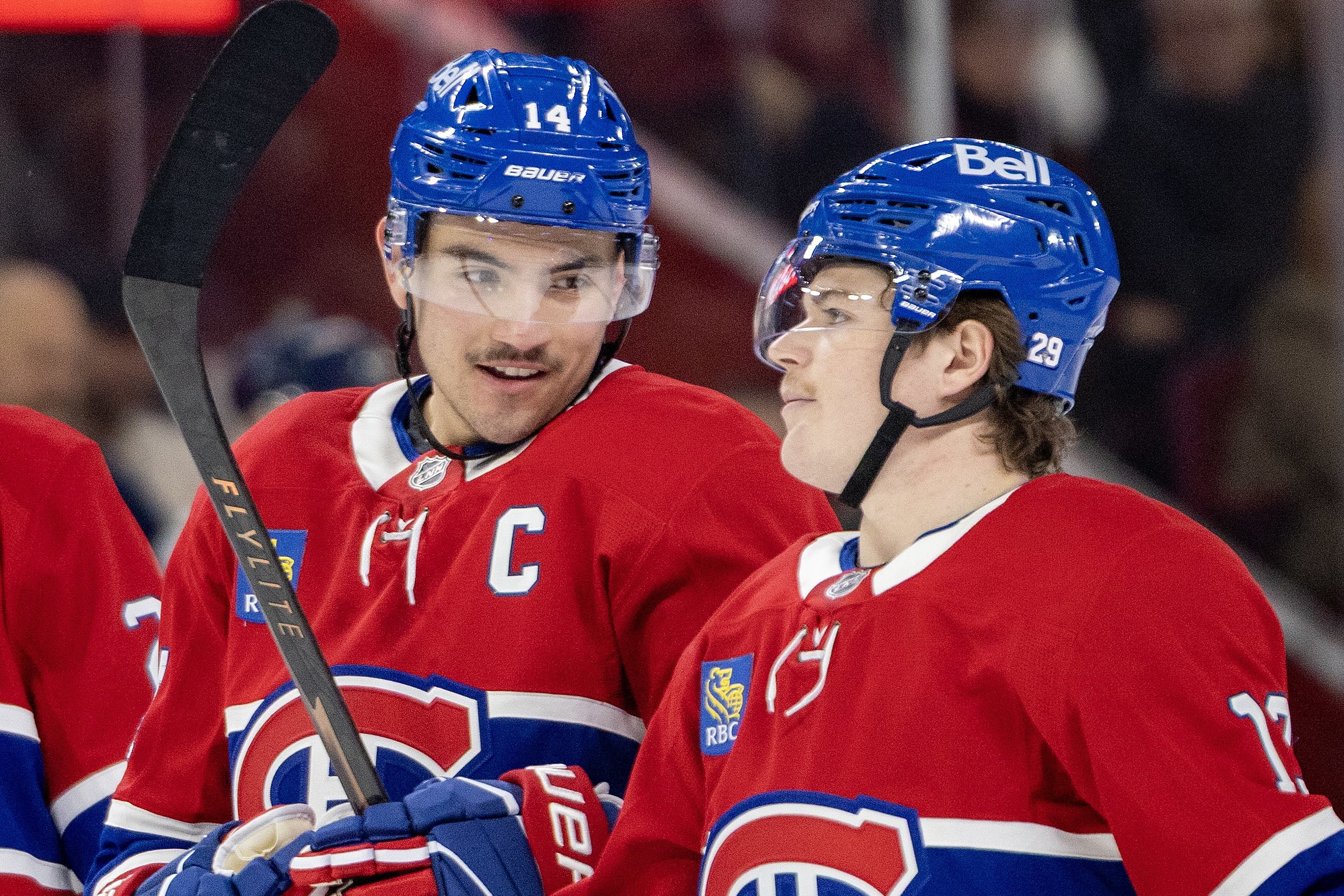 MONTREAL, QUE.: \November\ 20, 2025 -- Montreal Canadiens Nick Suzuki, left, and Cole Caufield confer during first period of National Hockey League game against the Washington Capitals in Montreal Thursday November 20, 2025.