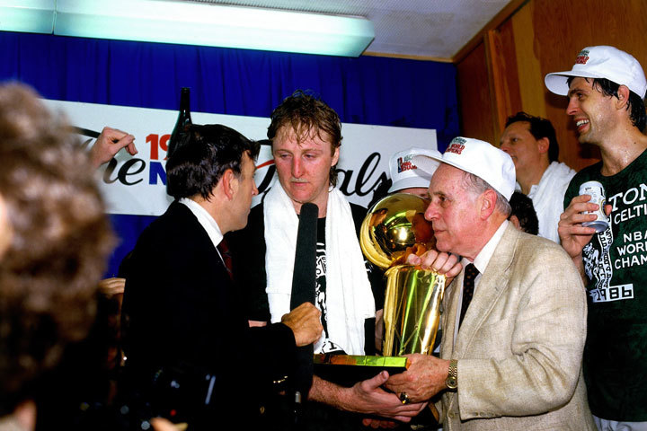 Larry Bird and Red Auerbach with the NBA championship trophy after Boston's 1986 title