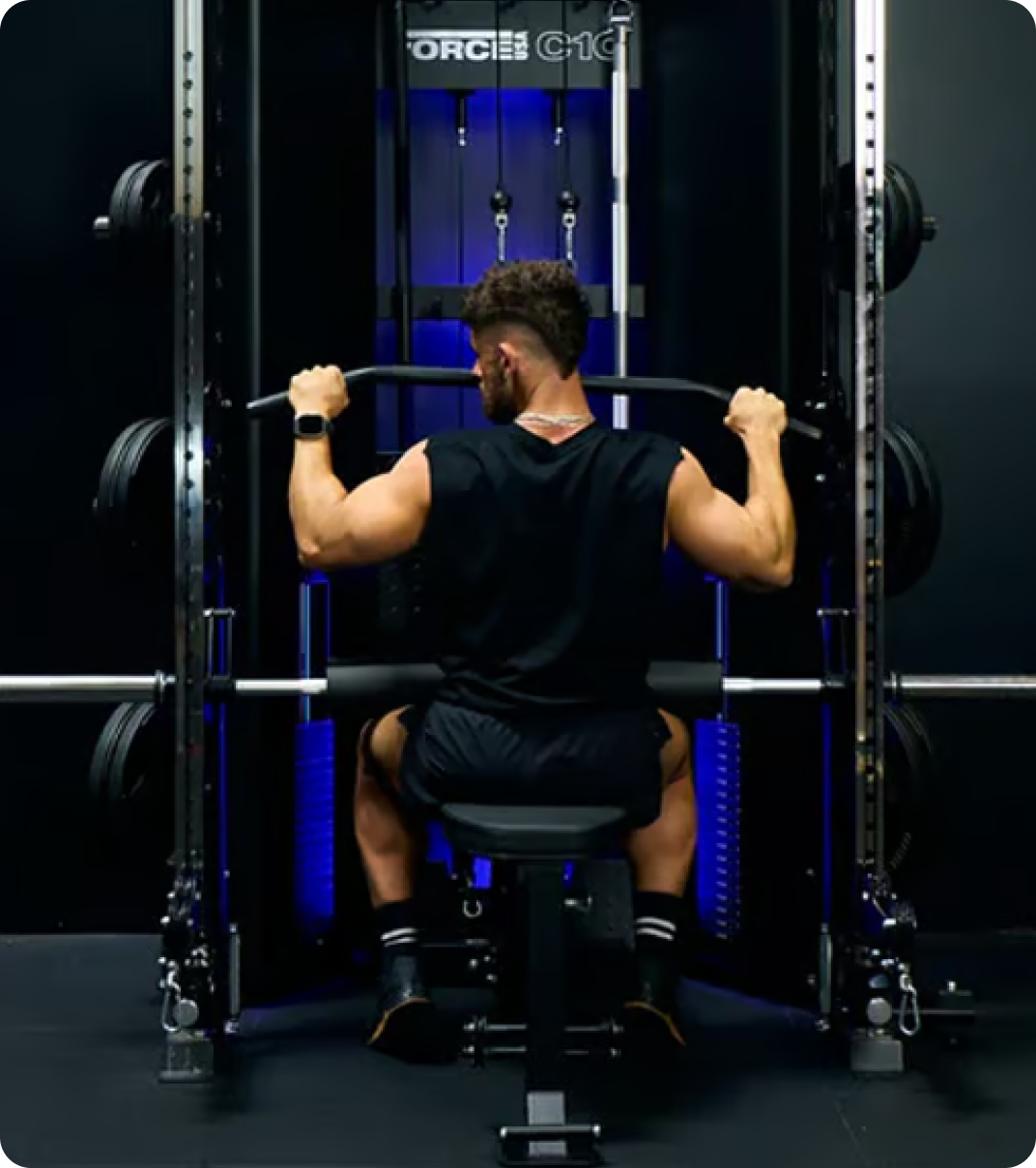 Man doing strength training with a Force USA All-In-One Trainer.