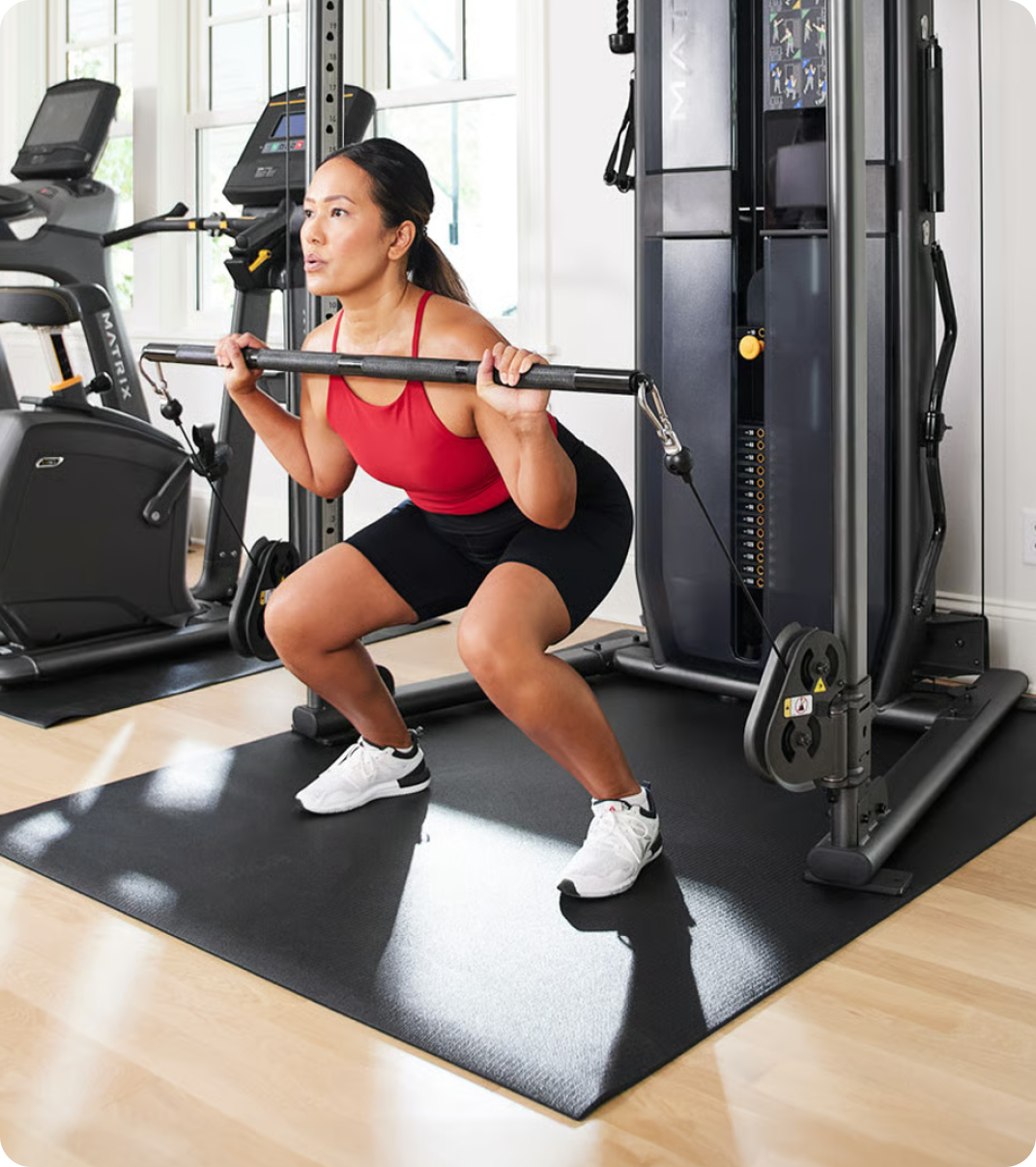 Woman working out with a Matrix FTR30 at home.