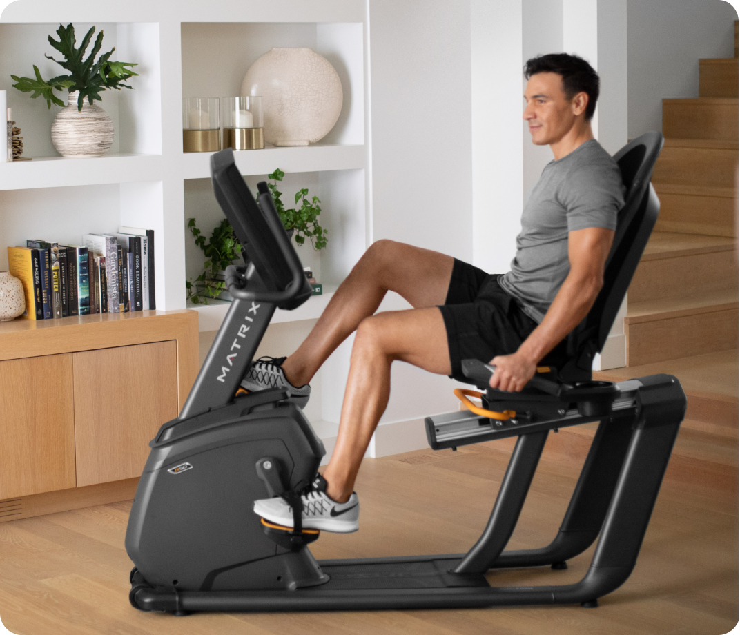 Man using a Matrix R50 bike in a modern home.